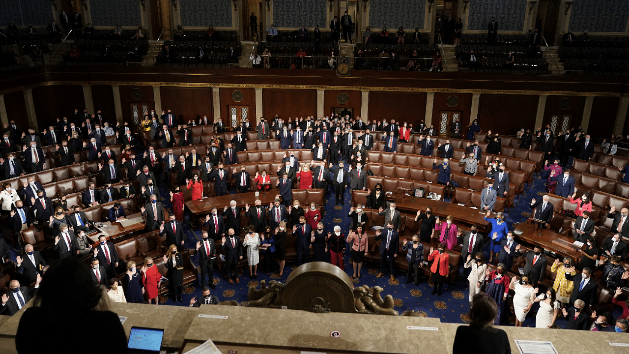 Members of the House of Representatives take their oath of office during the first session of the 117th Congress in Washington. Credit: Reuters Photo