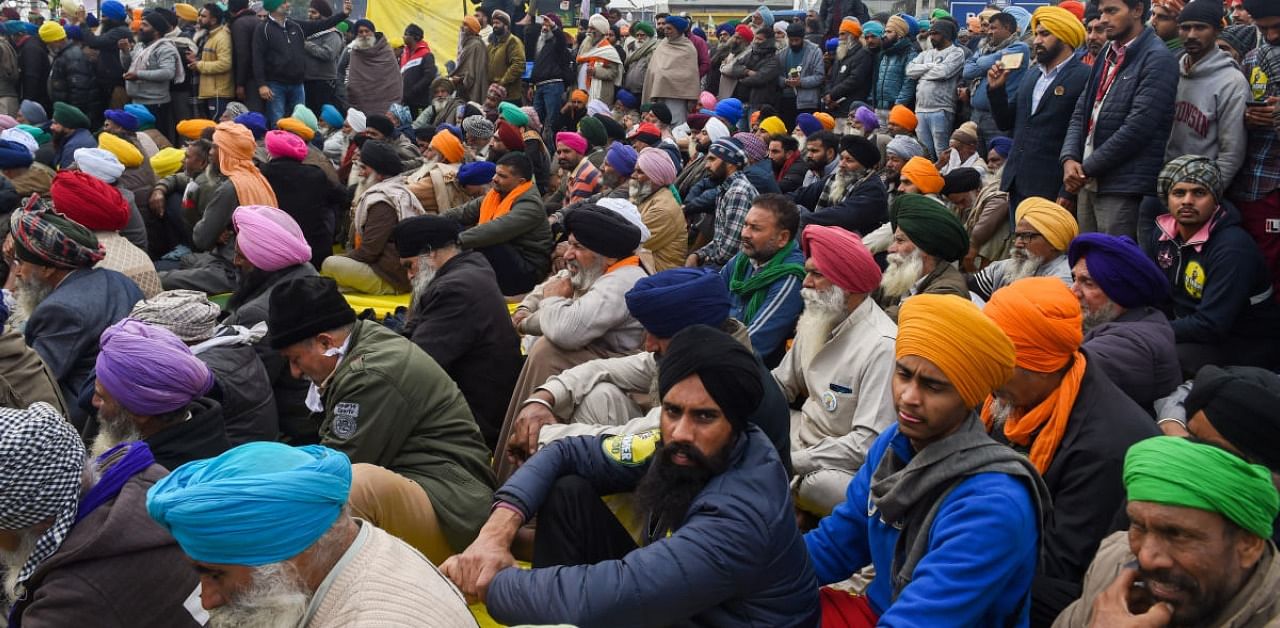 Farmers during their protest against the new farm laws, at Singhu border in New Delhi, Sunday, Jan. 03, 2021. Credit: PTI Photo