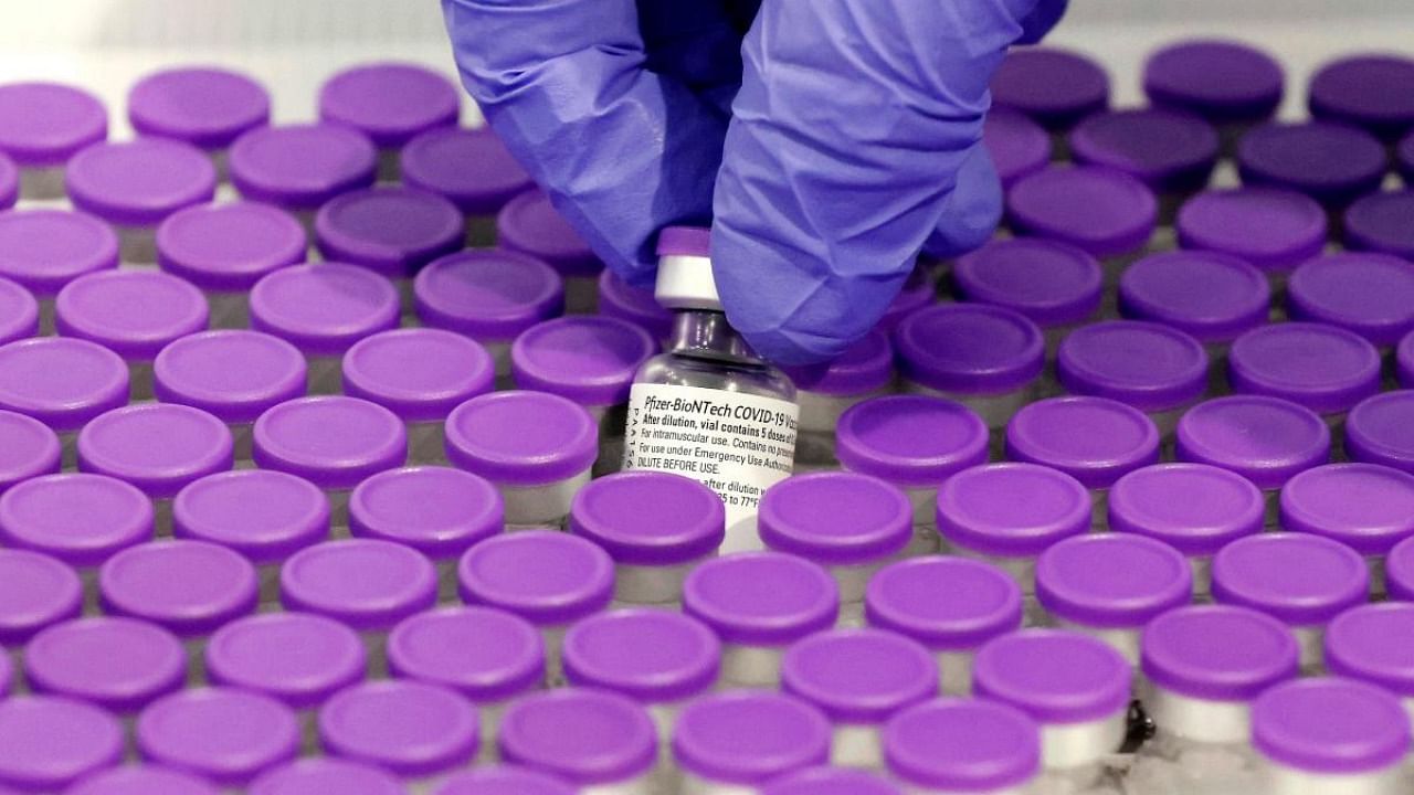 In this file photo taken on December 31, 2020 a healthcare worker prepares a dose of the Pfizer-BioNtech Covid-19 vaccine at a vaccination centre. Credit: AFP.