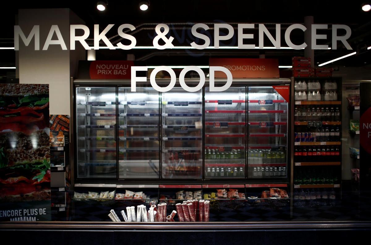 Empty shelves are seen behind a M&S logo at a Marks & Spencer food store in Paris, France, January 5, 2021. Credit: REUTERS