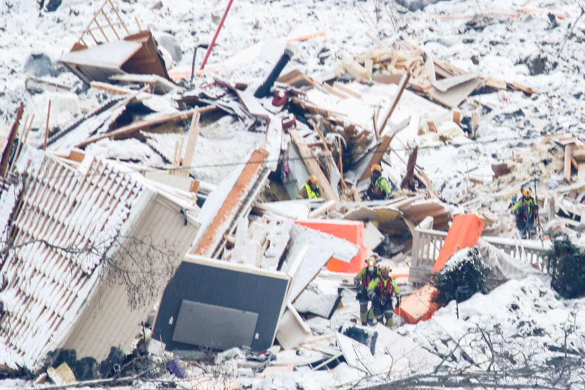 Rescue workers interrupt the search in the ruins, following the large landslide that destroyed several buildings, after an alarm was triggered in the area, in Ask, Gjerdrum, Norway January 5, 2021. Credit: NTB/Terje Pedersen via REUTERS