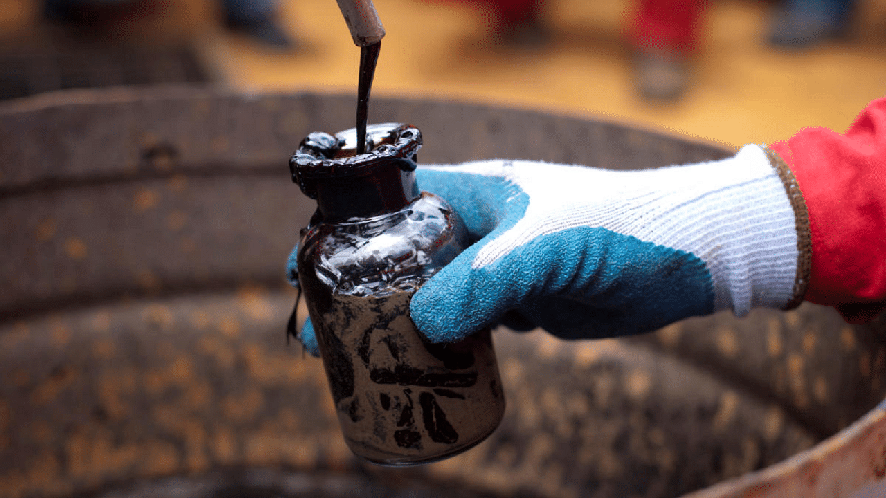 A worker collects a crude oil sample at an oil well operated by Venezuela's state oil company PDVSA in Morichal, Venezuela. Credit: Reuters File Photo