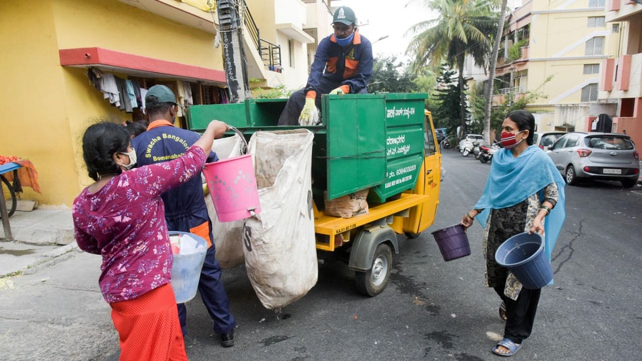 Tender for garbage collection was called two years ago with the condition to mandate waste segregation at source. Credit: DH file photo.