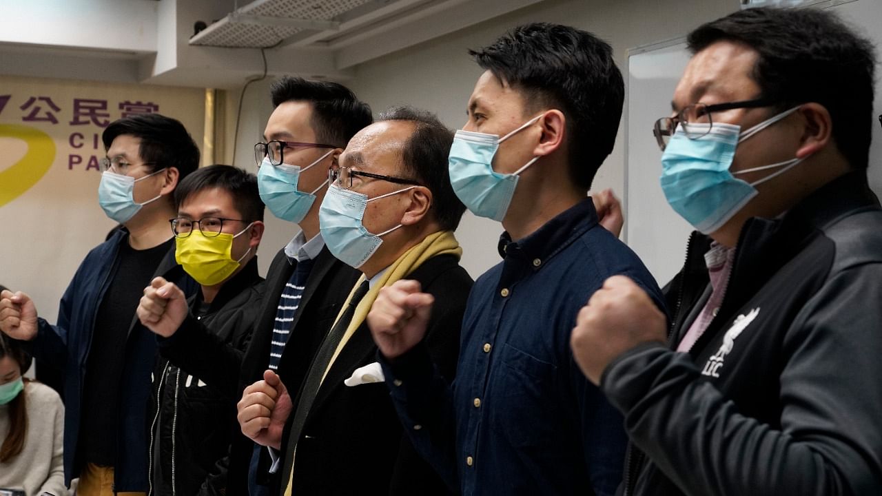 Pro-democratic party members shout slogans in response to the mass arrests during a press conference in Hong Kong. Credit: AP/PTI Photo