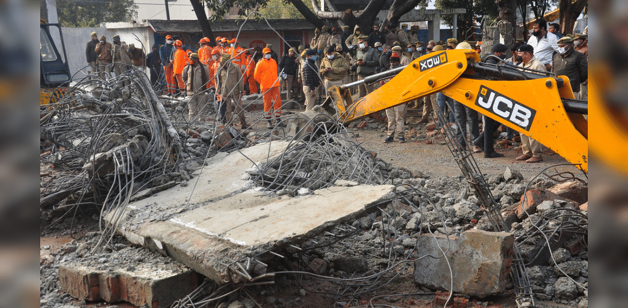 Rescue operation carried out by NDRF personnel after the complex roof of a crematorium collapsed due to heavy rain, at Muradnagar in Ghaziabad. Credit: PTI Photo