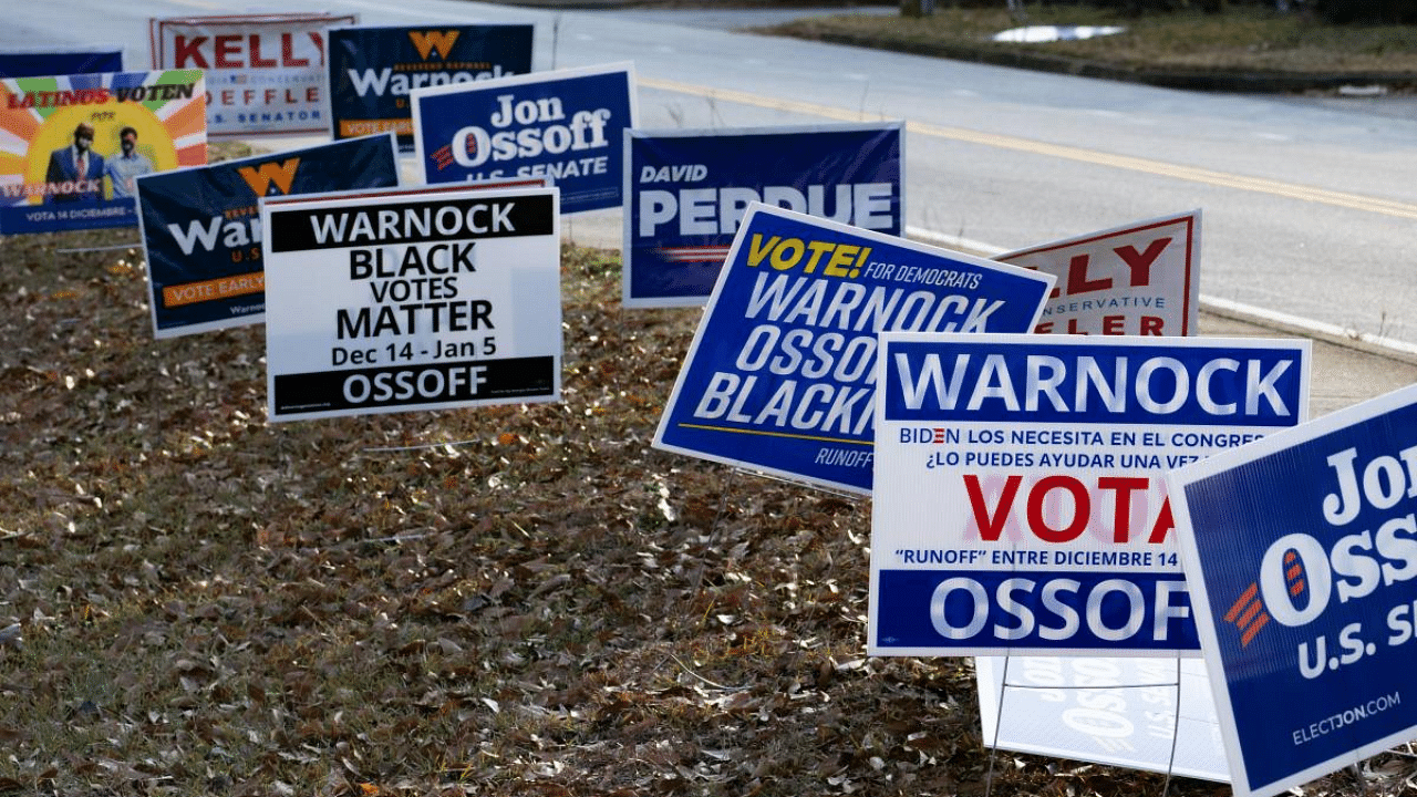 Signs line a road at a Gwinnett County voting location in Atlanta, Georgia. Credit: AFP Photo