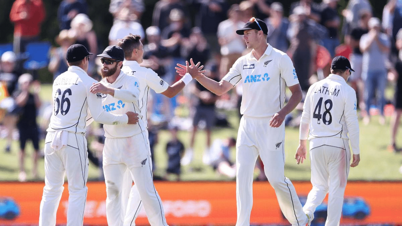 (L-R) Tom Blundell, captain Kane Williamson, Trent Boult, Tom Latham, Kyle Jamieson and Tom Latham celebrate their series win during day four of the second international cricket Test match between New Zealand and Pakistan at Hagley Oval in Christchurch. Credit: AFP Photo