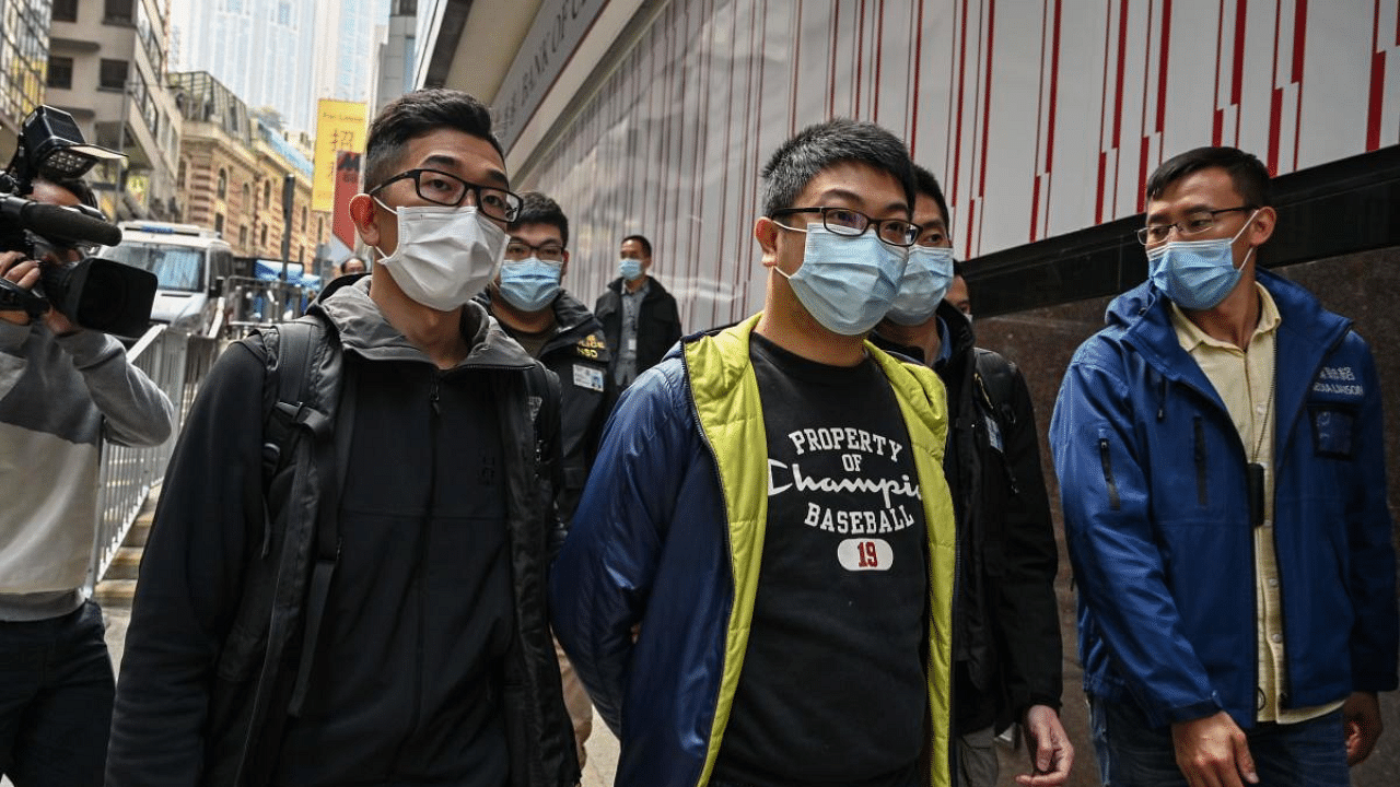 Ben Chung (front C) of a pro-democracy political group is arrested by police in the Central district after as many as 50 Hong Kong opposition figures were arrested in Hong Kong on January 6, 2021, under a new national security law in the largest operation yet against Beijing's critics. Credit: AFP Photo