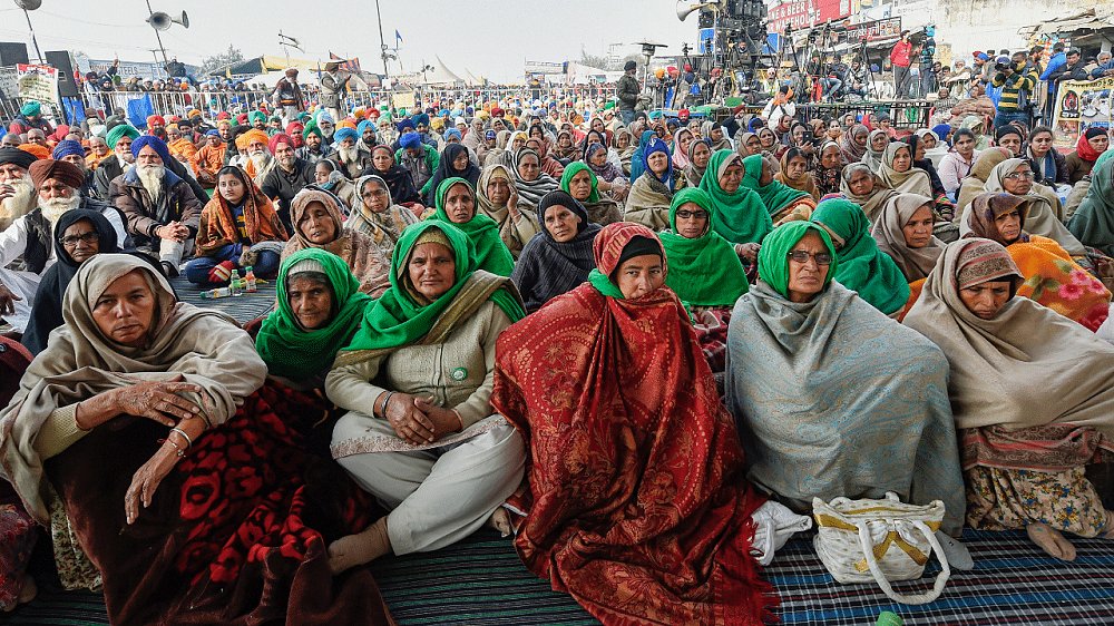 Women farmers during their ongoing protest against new farm laws, at Singhu border in New Delhi. Credit: PTI Photo