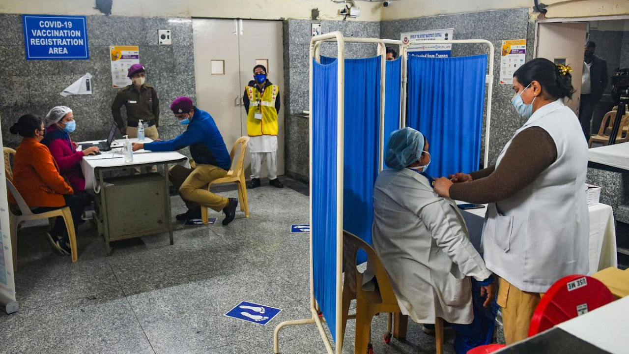Medics conduct the dry run as part of preparedness for the administration of Covid-19 vaccine, at Kasturba Hospital in New Delhi. Credit: PTI.