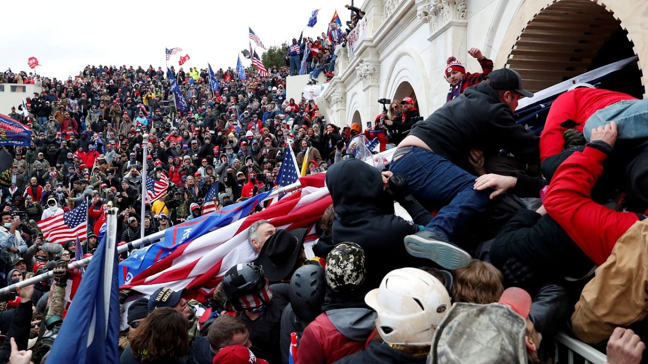 Pro-Trump protesters storm into the US Capitol during clashes with police, during a rally to contest the certification of the 2020 US presidential election results by the US Congress, in Washington, US, January 6, 2021. Credit: Reuters Photo