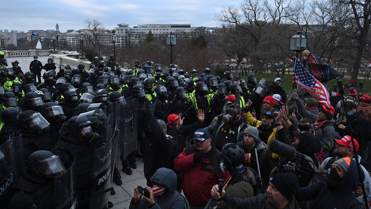 Trump supporters confront police and security forces at the US Capitol in Washington, DC. Credit: AFP Photo