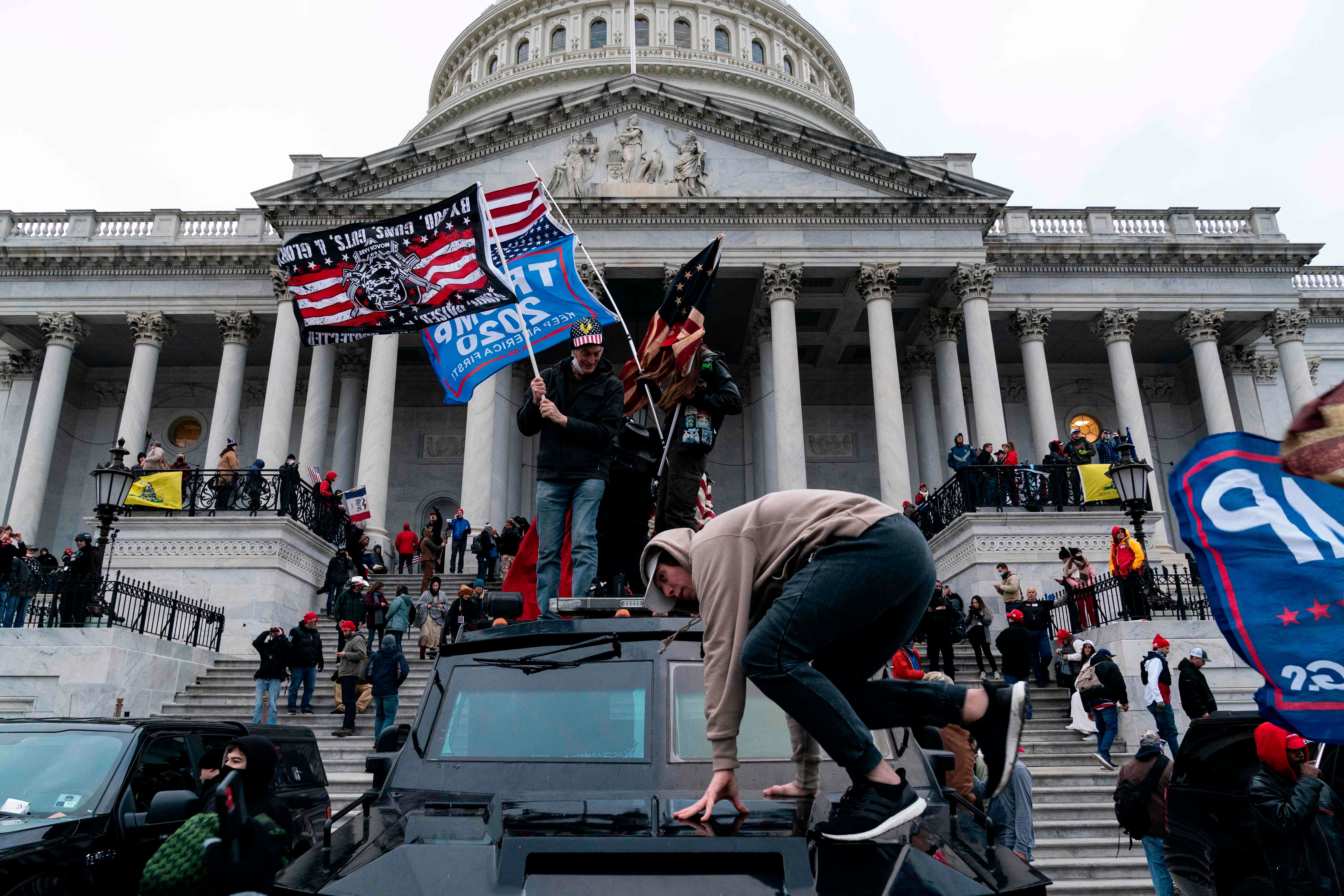 Supporters of US President Donald Trump protest outside the US Capitol on January 6, 2021, in Washington, DC. - Demonstrators breeched security and entered the Capitol as Congress debated the a 2020 presidential election Electoral Vote Certification. Credit: AFP Photo