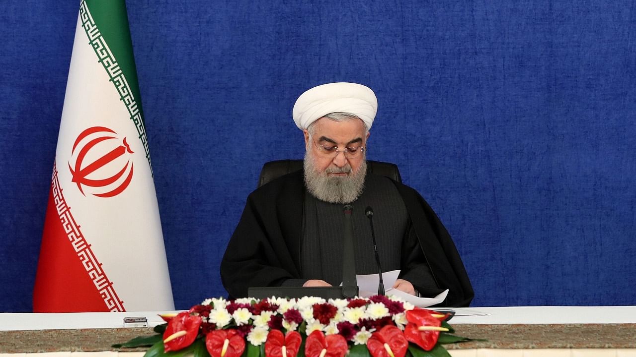 A handout picture provided by the Iranian presidency on January 7, 2021, shows Iranian President Hassan Rouhani during a video conference on economical projects from his office in the capital Tehran. Credit: AFP Photo