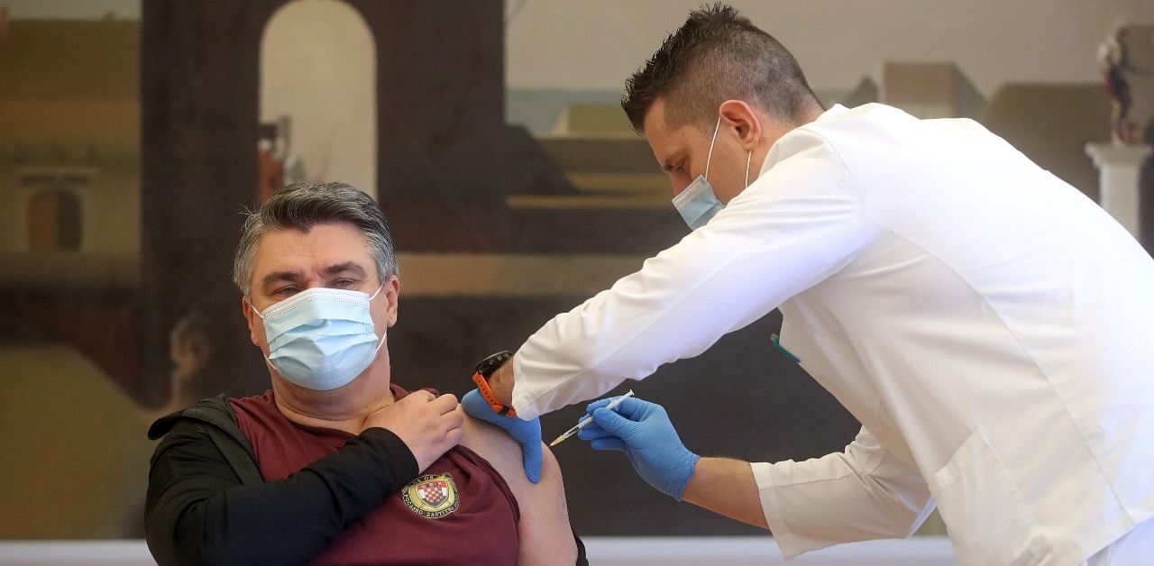 A medical worker administers a Covid-19 vaccine shot to Croatian President Zoran Milanovic in Zagreb on January 7, 2021. Credit: AFP Photo