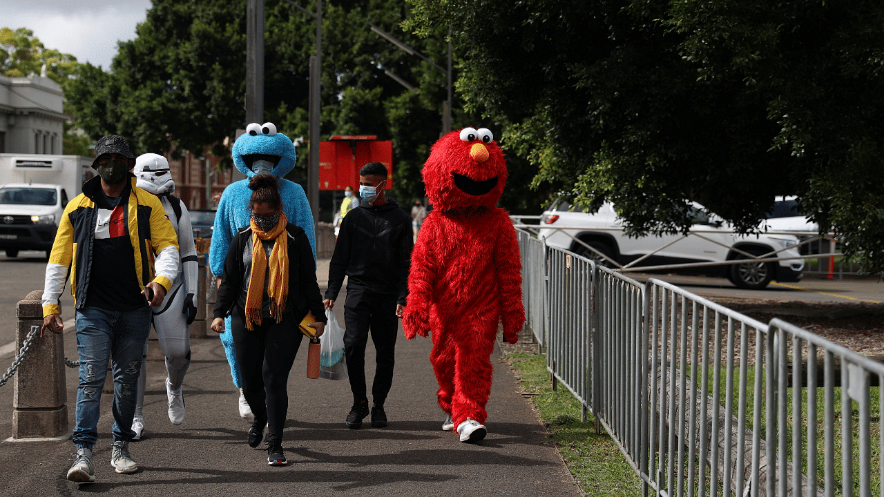 Costumed cricket fans arrive at the Sydney Cricket Ground for the first day of the third test between India and Australia. Credit: Reuters Photo