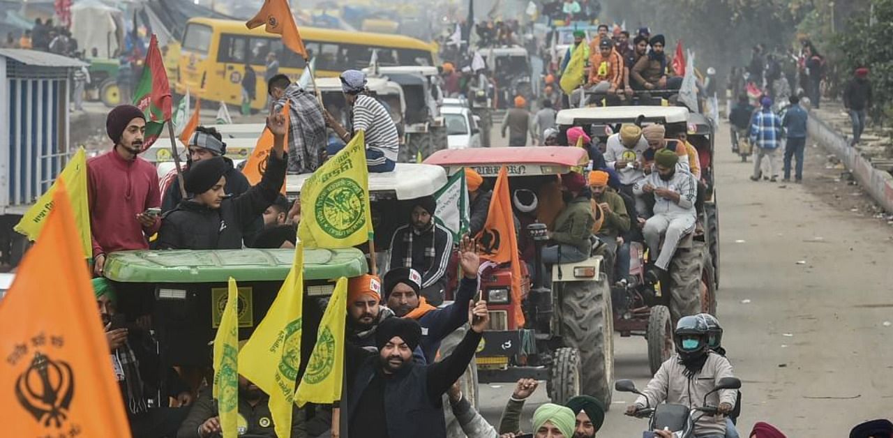 Farmers on their way to Tikri border during a tractor rally as part of their ongoing protest against the new farm laws, at Western Peripheral Expressway in Kundli, Sonipat, Thursday, Jan. 07, 2021. Credit: PTI Photo