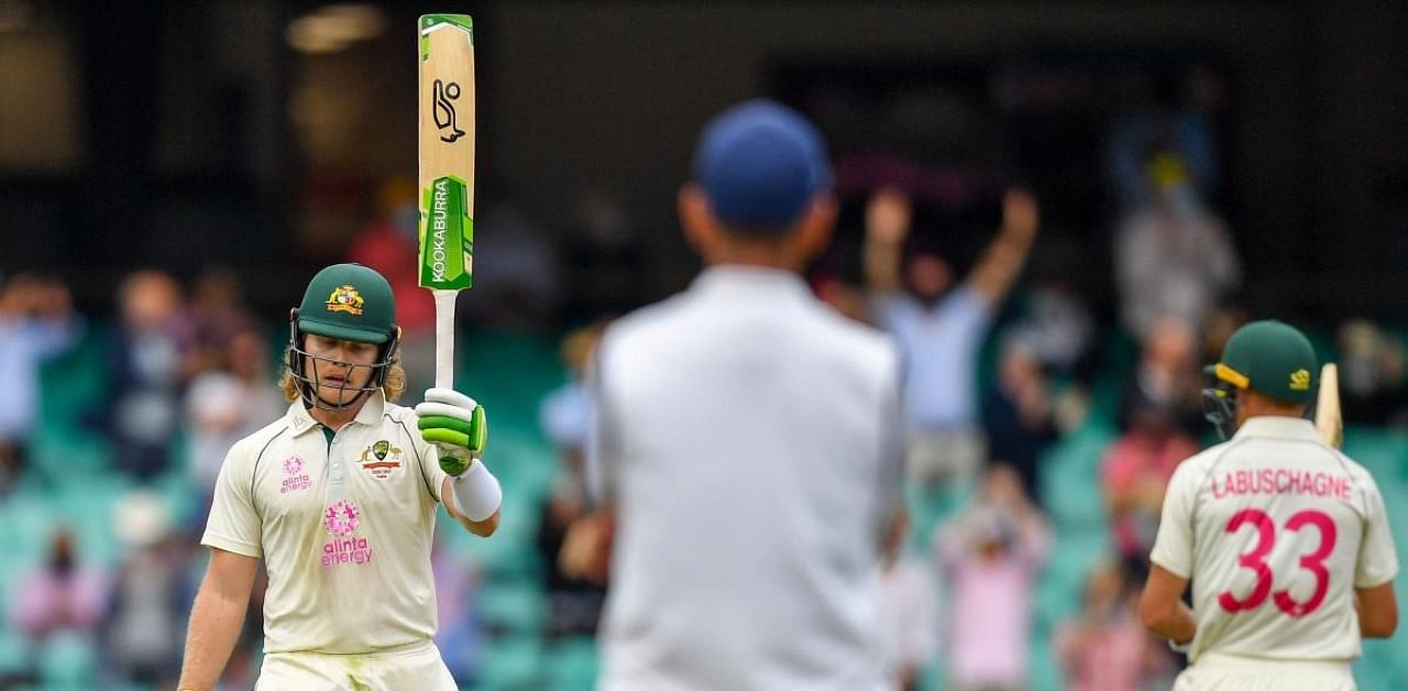Australia's Will Pucovski celebrates after scoring a half-century (50 runs) during the first day of the third cricket Test match between Australia and India at the Sydney Cricket Ground (SCG) in Sydney on January 7, 2021. Credit: AFP Photo
