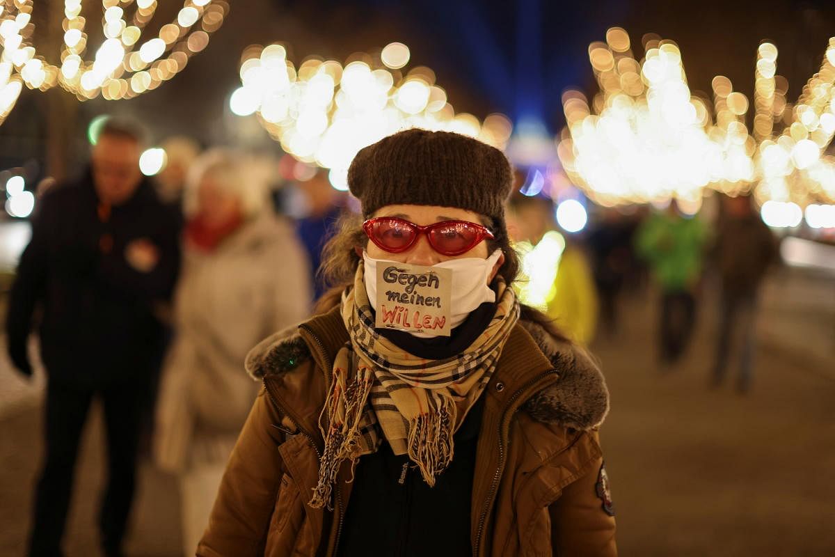 A protester wears a face mask with a sign reading "Against my will" during a protest against the government's coronavirus disease (COVID-19) restrictions in Berlin, Germany December 30, 2020. Credit: Reuters Photo