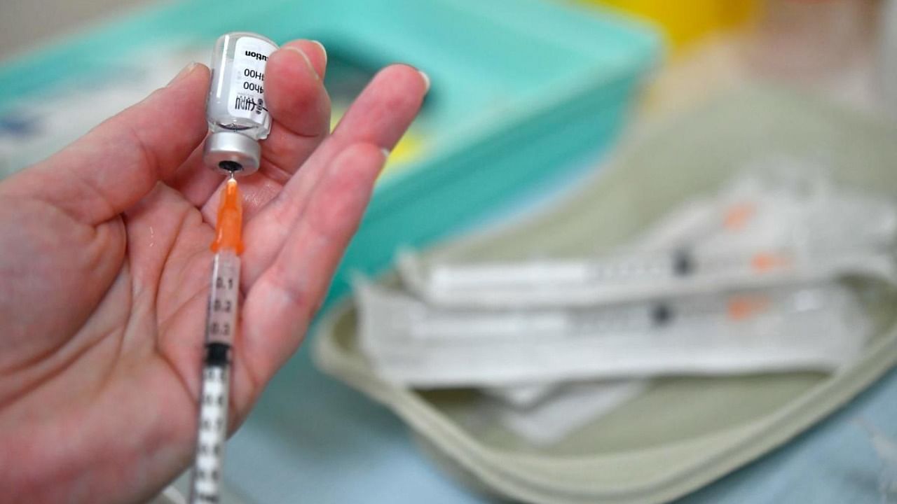 A nurse prepares a syringe with a dose of the Pfizer-BioNTech Covid-19 vaccine on January 8, 2021 at the Cavale Blanche hospital in Brest, western France during a vaccination operation of the medical staff against the Covid-19 disease. Credit: AFP.