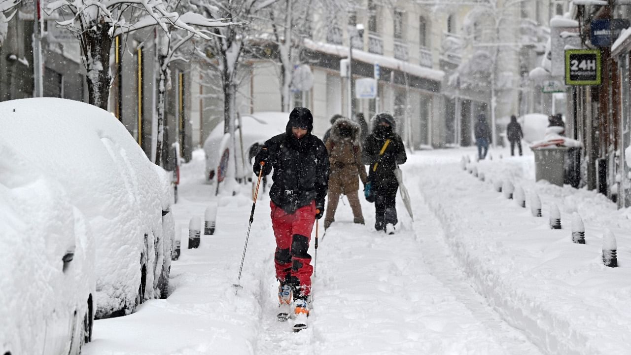 Snowstorms across much of Spain left three people dead and caused chaos across much of the country, trapping motorists and closing the capital's air and rail links, with more falls to come. Credit: AFP Photo