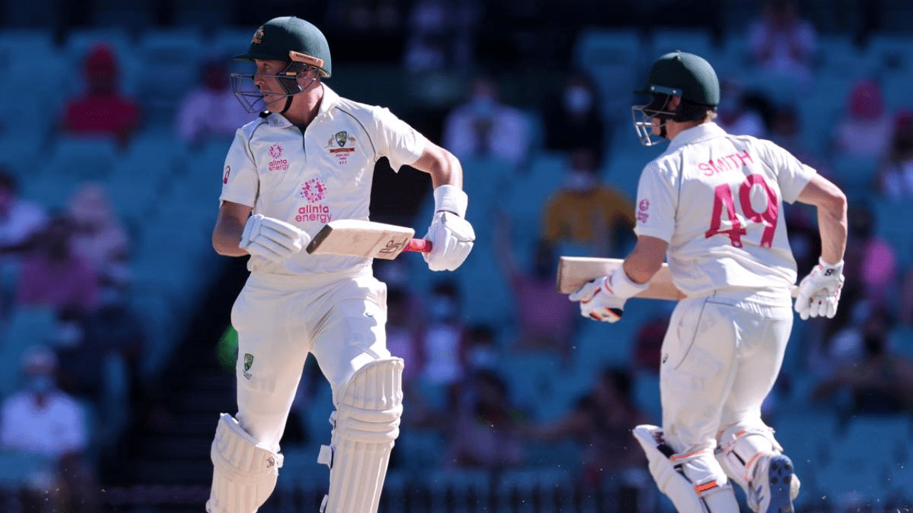 Australia's Marnus Labuschagne (L) and Steven Smith run between the wickets on the third day of the third cricket Test match between Australia and India at the Sydney Cricket Ground (SCG) in Sydney. Credit: AFP Photo