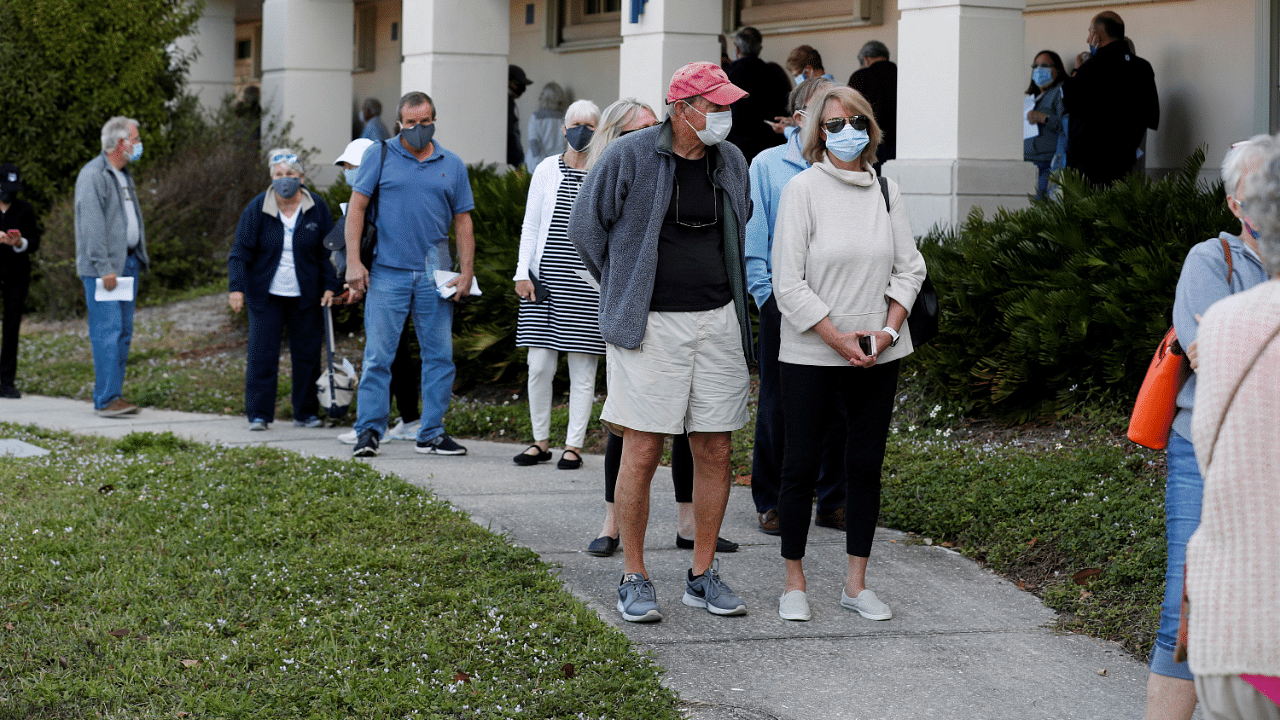 Seniors, who are 65 and over, wait in line at the Department of Health Sarasota Covid-19 vaccination clinic in Sarasota, Florida. Credit: Reuters Photo