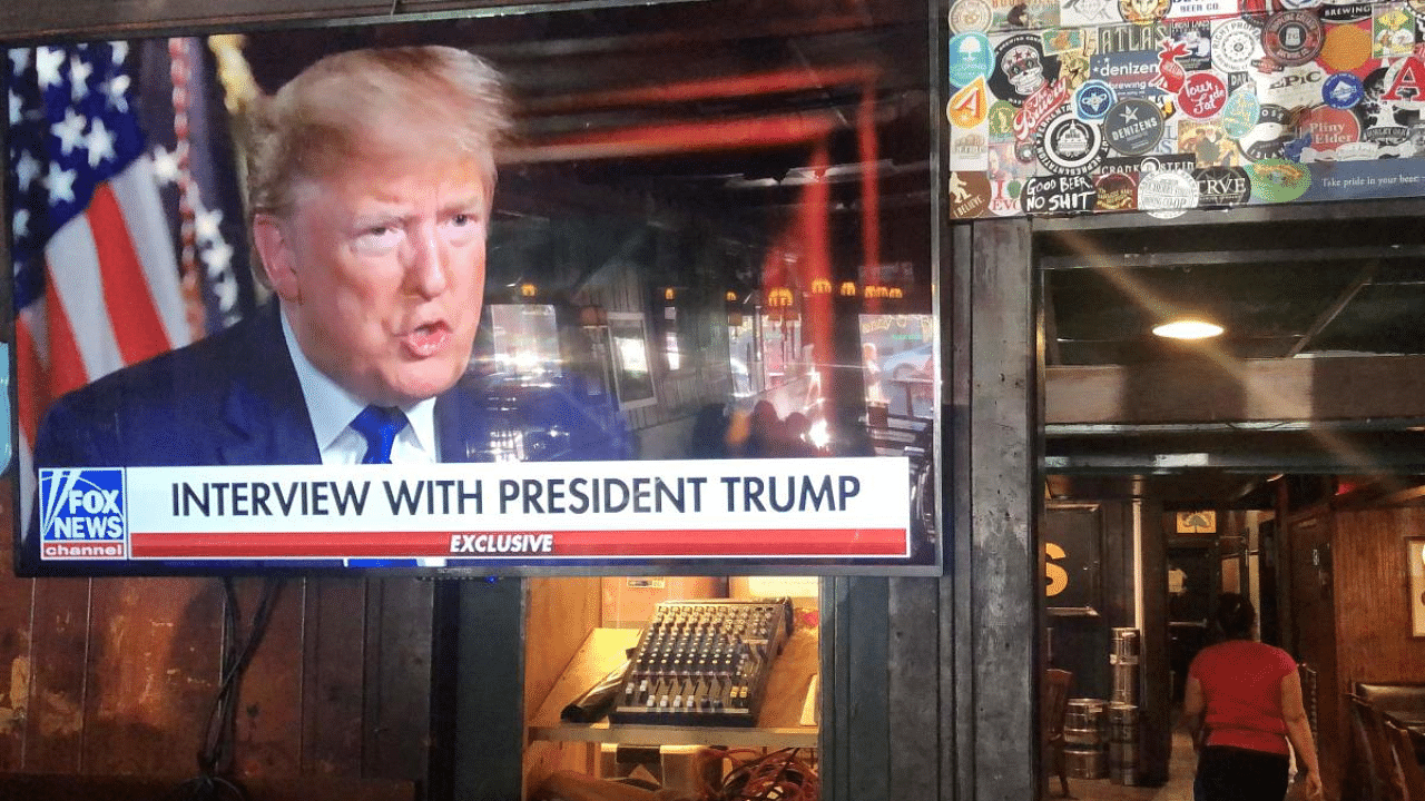  President Donald Trumps pre-game Super Bowl interview with Fox News is broadcast in a bar in Washington DC. Credit: AFP File Photo
