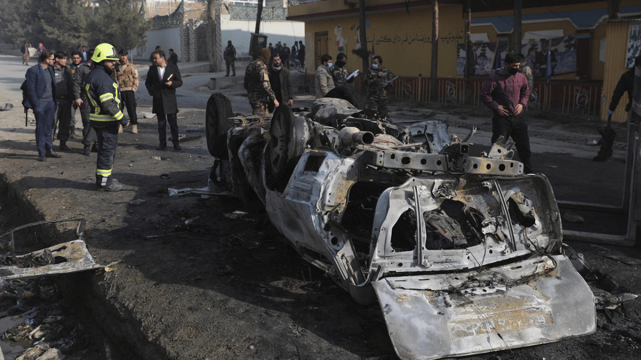 Afghan security officers inspect the site of a bombing attack in Kabul, Afghanistan. Credit: AP/PTI