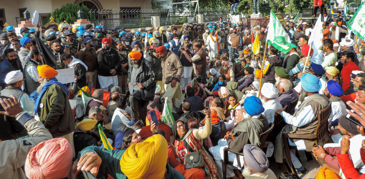 Farmers stage a protest against the center's new farm laws. Representative Image. Credit: PTI Photo