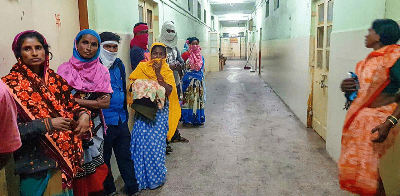 Women stand in a corridor at the Bhandara General Hospital, where a fire broke out, in Bhandara district, Saturday, Jan. 9, 2021. Ten infants died after a fire broke out in the special newborn care unit of hospital. Credit: PTI Photo