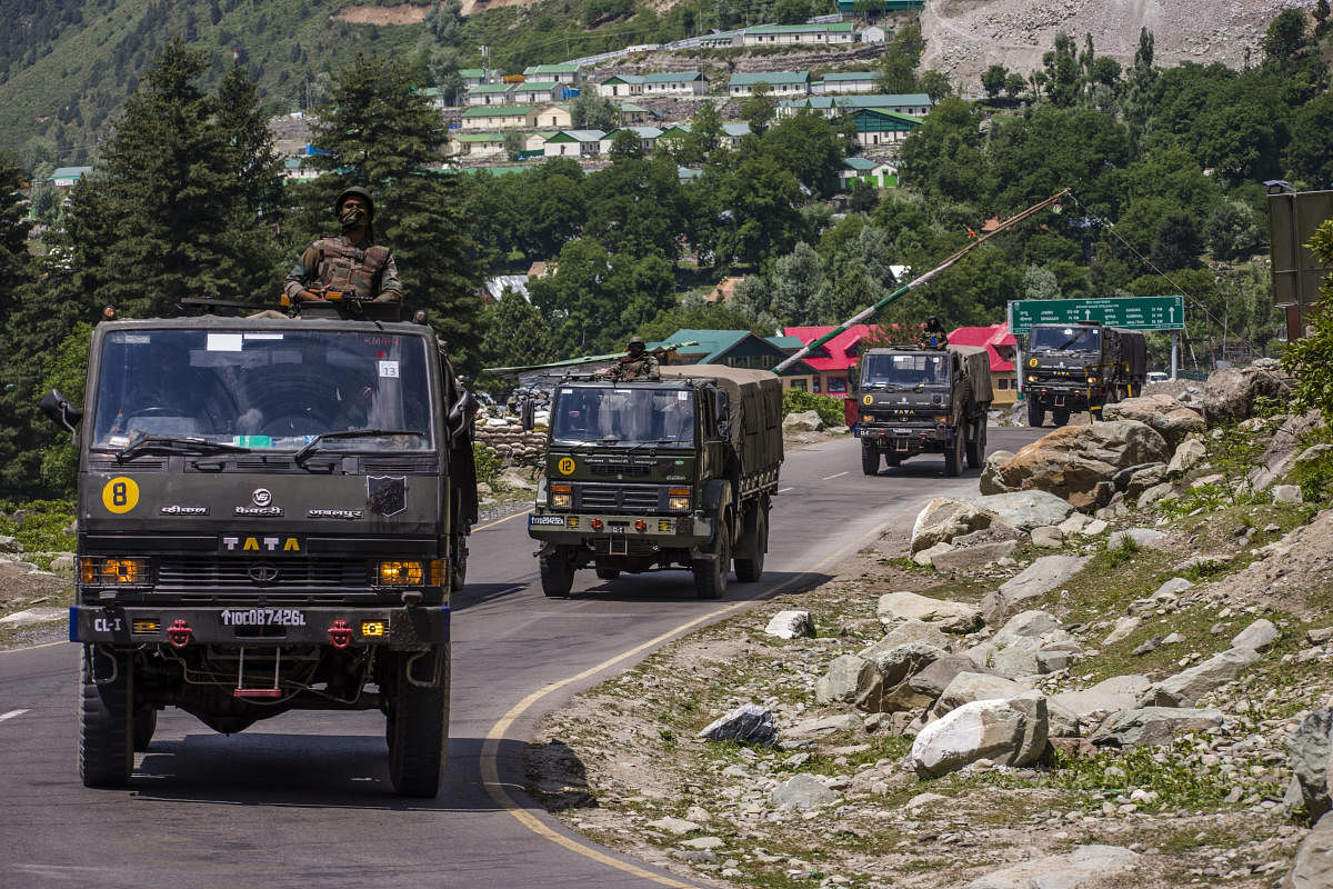 An Indian Army convoy drives towards Leh, on a highway bordering China, on June 19, 2020, four days after 20 Indian soldiers were killed at Galwan Valley in Ladakh.