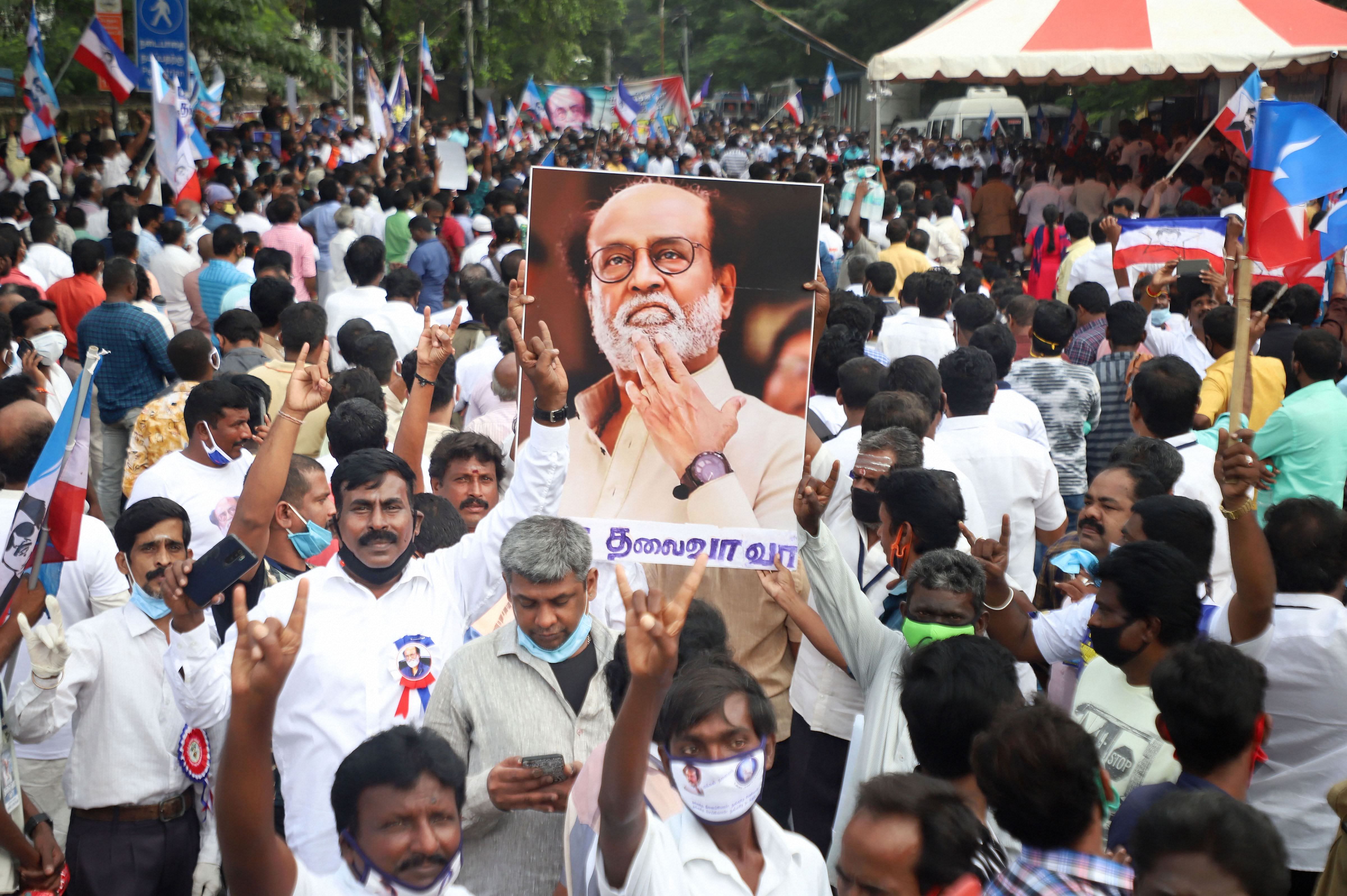 Fans of superstar Rajinikanth stage a demonstration demanding from him to join politics as earlier as promised, at Valluvar Kottam in Chennai, Sunday, Jan. 10, 2021. The actor, who finally appeared ready to launch his political party with a "now or never" announcement about a month ago, has now decided to opt for the latter course, citing health concerns. Credit: PTI Photo