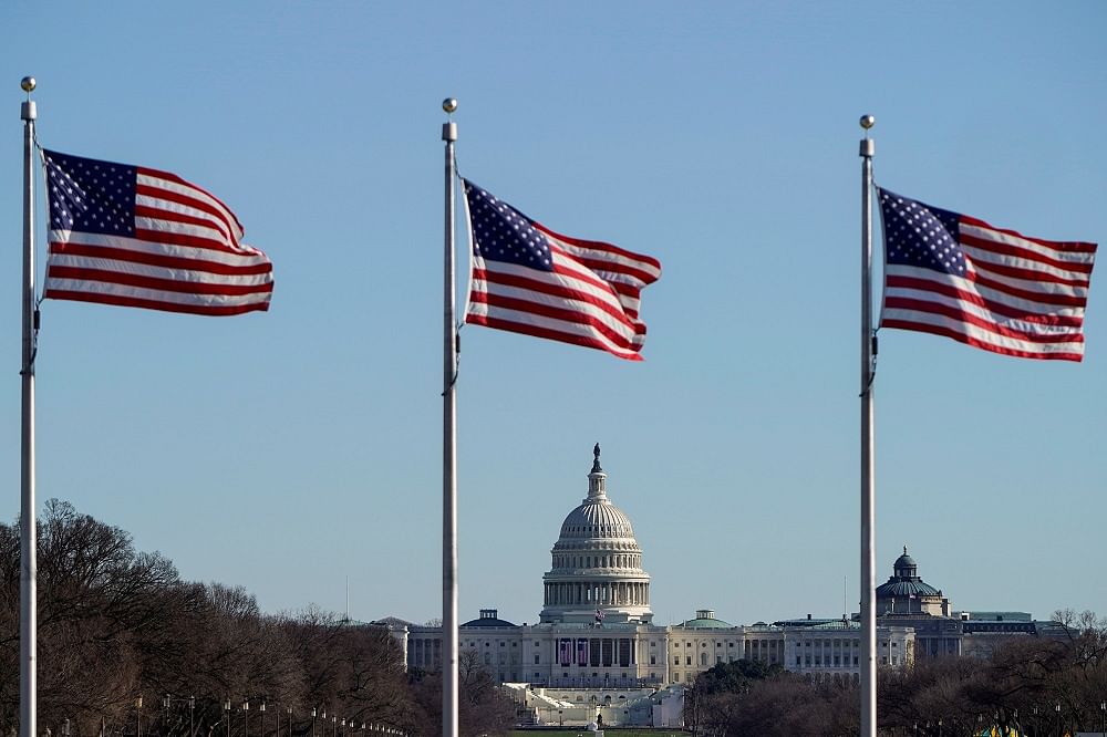 The US Capitol is seen under flags in Washington. Credit: Reuters Photo