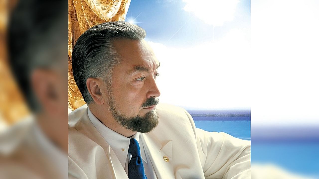 Adnan Oktar preached conservative views while women he called his "kittens" danced around him in the TV studio. Credit: Wikimedia Commons