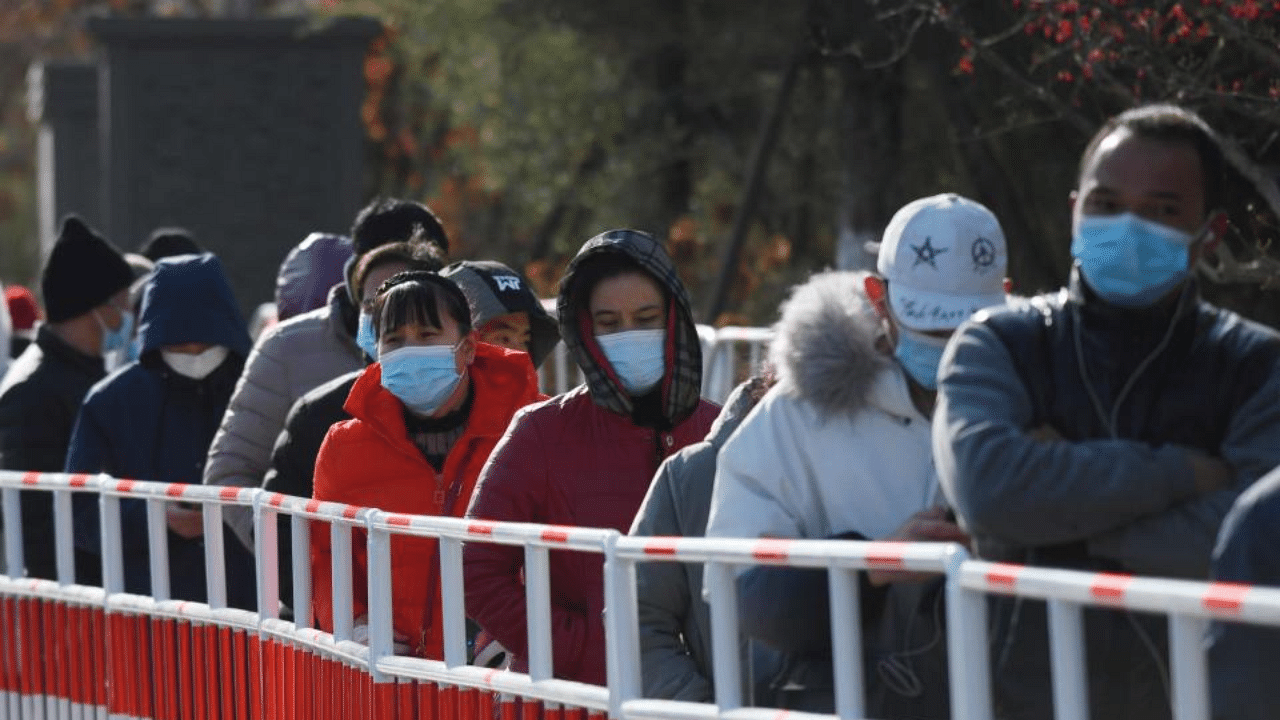 Residents line up to be tested for the COVID-19 coronavirus in Beijing on January 11, 2021, following new cases of the virus emerging in the province which surrounds Beijing. Credit: AFP Photo