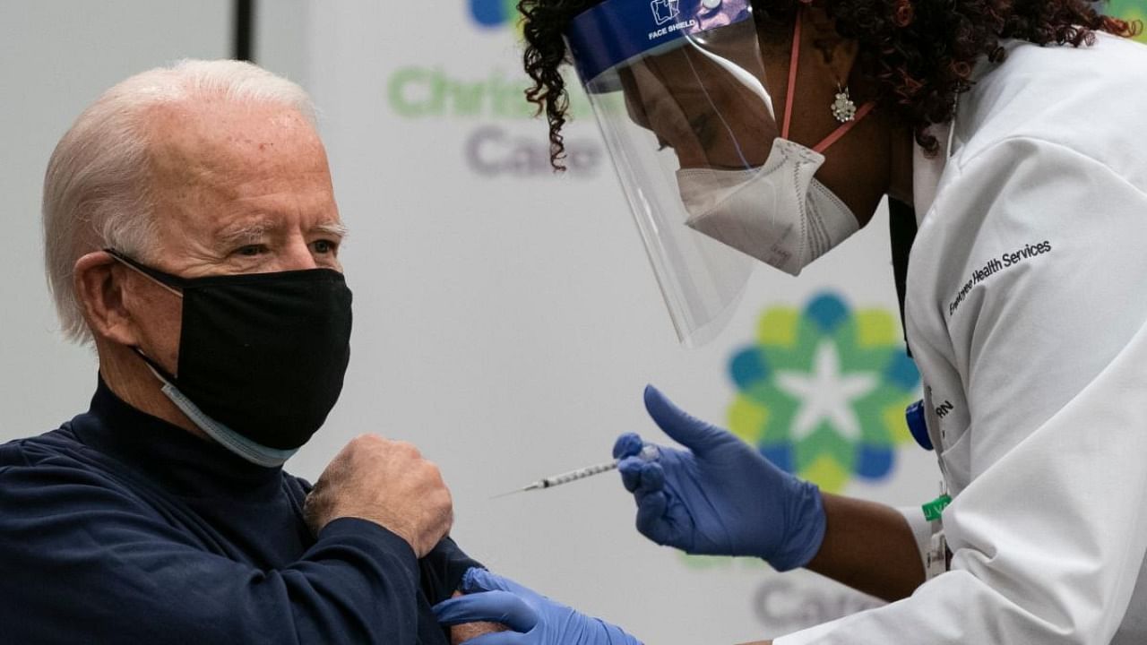 US President-elect Joe Biden receives a Covid-19 vaccination from Tabe Mase, Nurse Practitioner and Head of Employee Health Services, at the Christiana Care campus in Newark, Delaware. Credit: AFP.