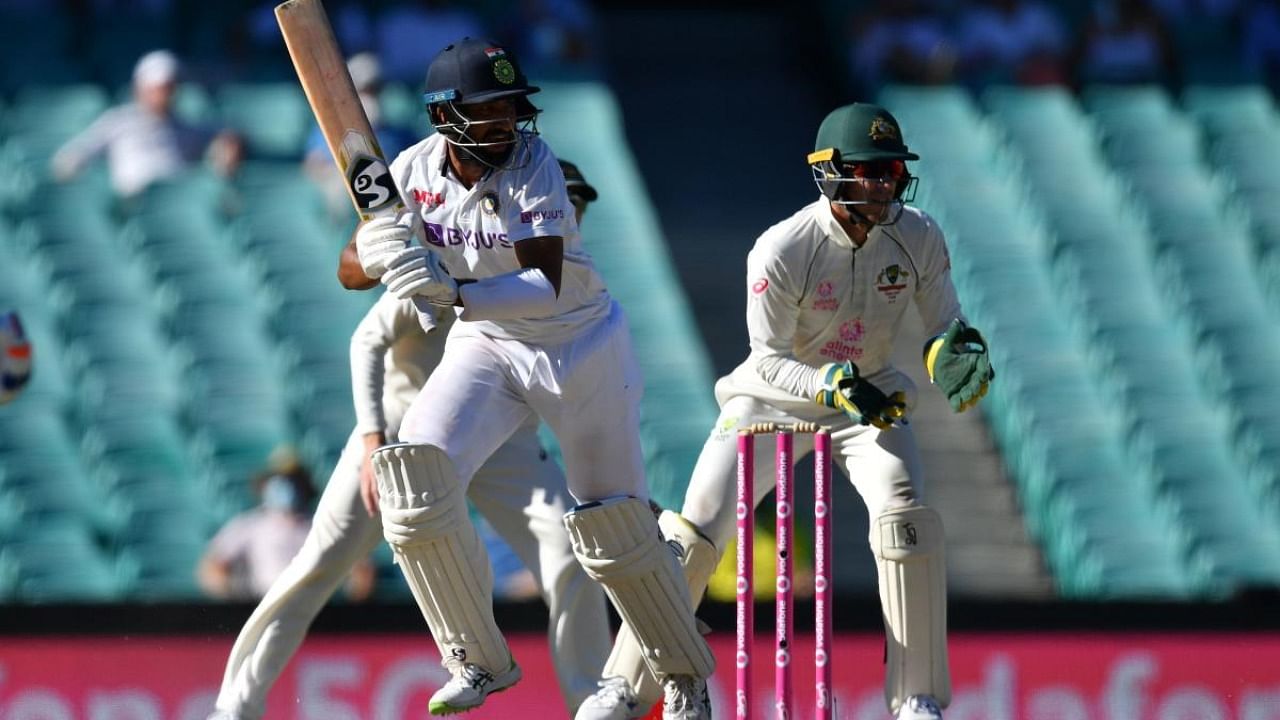 Cheteshwar Pujara plays a shot on the fourth day of the third cricket Test match between Australia and India at the Sydney Cricket Ground (SCG) in Sydney. Credit: AFP.
