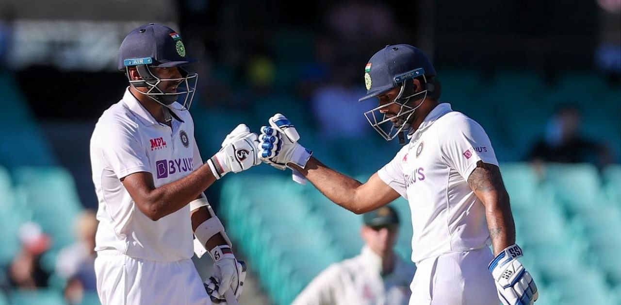 Ravichandran Ashwin (L) and teammate Hanuma Vihari. Credit: AFP Photo