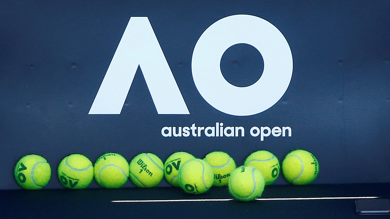 Tennis balls are pictured in front of the Australian Open logo before the tennis tournament. Credit: Reuters File Photo