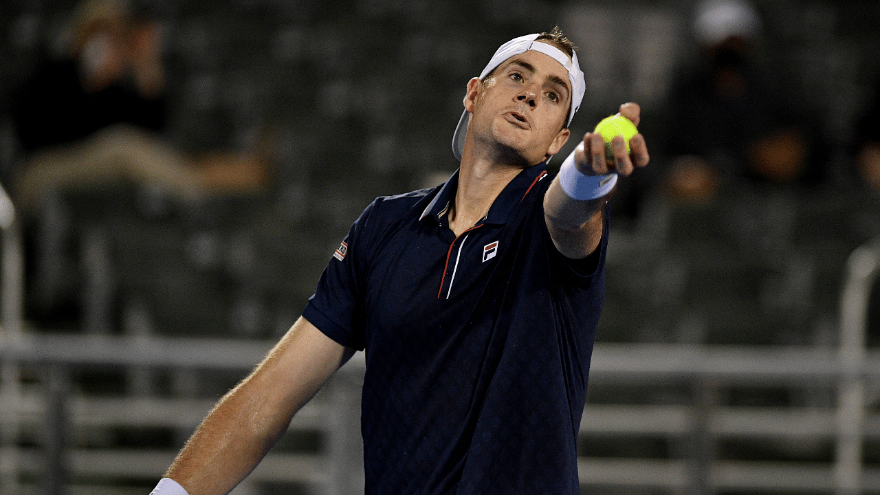 John Isner of the United States serves to Sebastian Korda of the United States during the Quarterfinals of the Delray Beach Open. Credit: AFP Photo