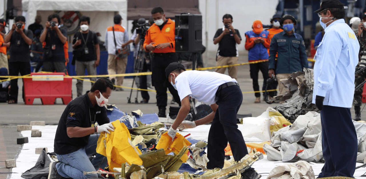 Jakarta:Indonesian National Transportation Safety Committee (KNKT) investigators inspect the debris found in the waters around the location where Sriwijaya Air passenger jet crashed at Tanjung Priok Port in Jakarta, Indonesia. Credit: AP Photo