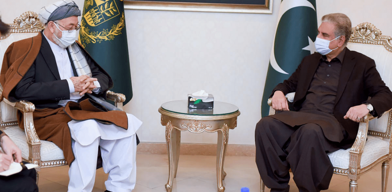  Pakistan's Ministry of Foreign Affairs, Karim Khalili, left, an influential Afghan Shiite leader, meets with Pakistani Foreign Minister Shah Mahmood Qureshi at Foreign Ministry in Islamabad, Pakistan. Credit: AP Photo