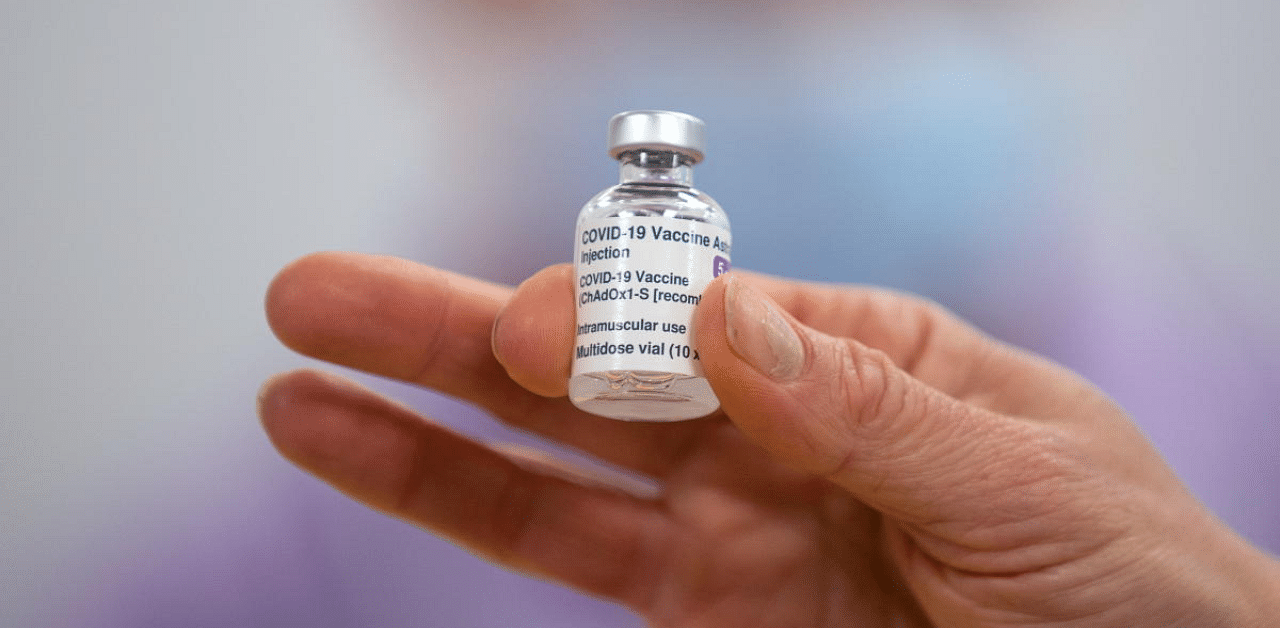A person holds a vial of the Oxford/AstraZeneca Covid-19 vaccine. Credit: Reuters Photo