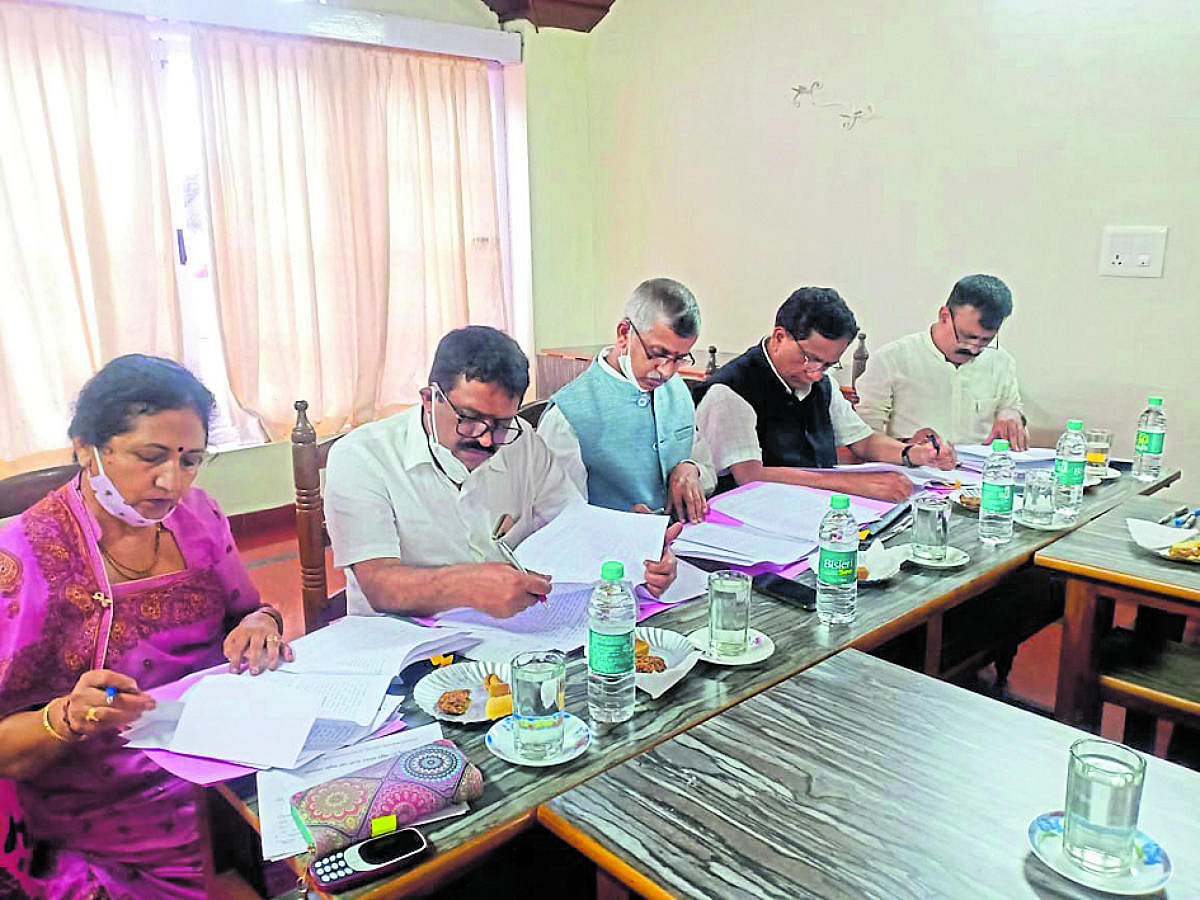 Madikeri Urban Development Authority president K S Ramesh Holla chairs a meeting in Madikeri.