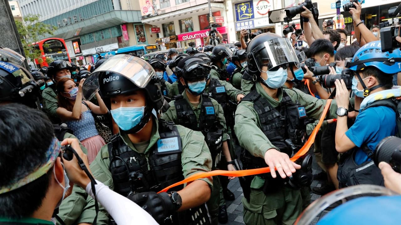 Riot police disperse pro-democracy protesters during a demonstration opposing postponed elections, in Hong Kong. Credit: Reuters file photo.