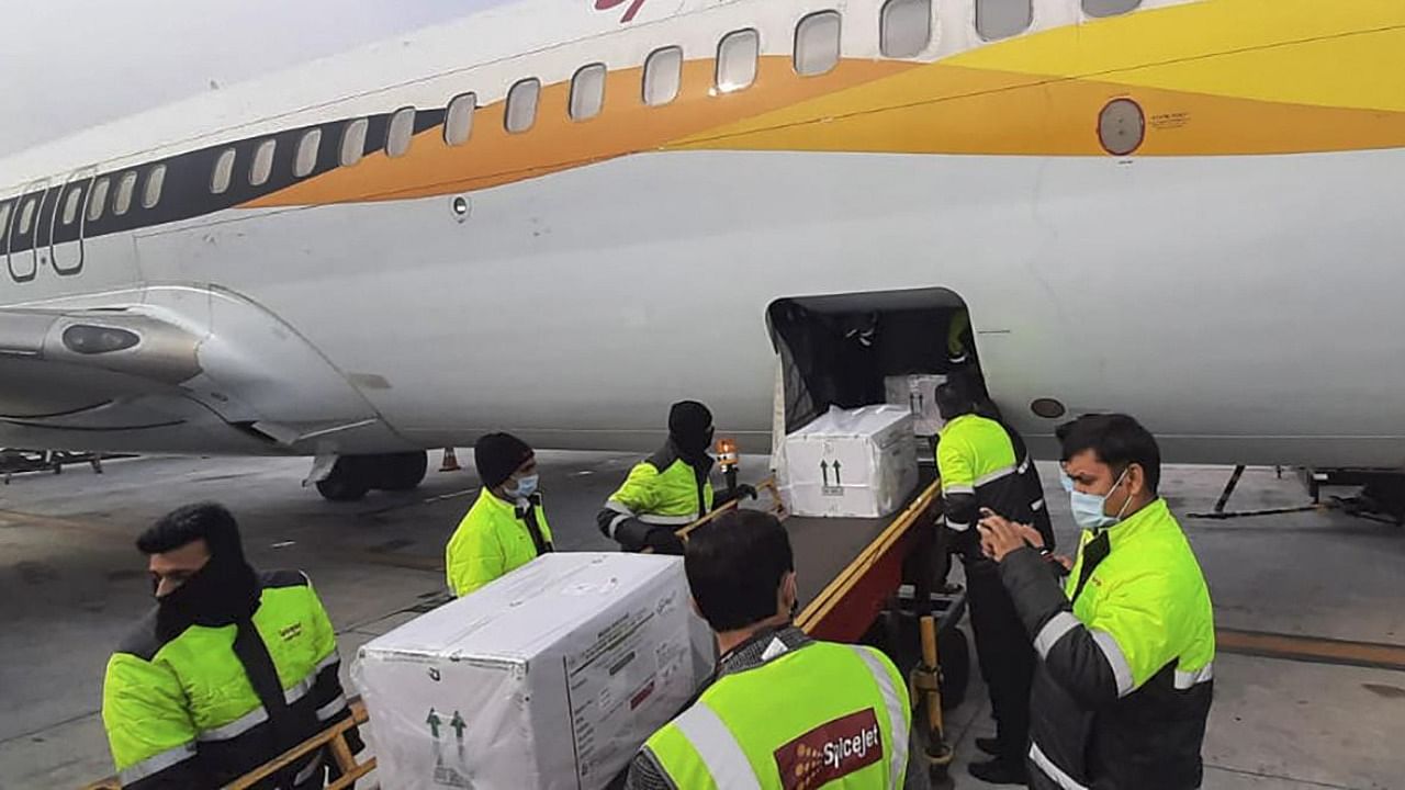 First consignment of Covid-19 vaccine arrives at Delhi Airport in a special SpiceJet flight from Pune. Credit: PTI.