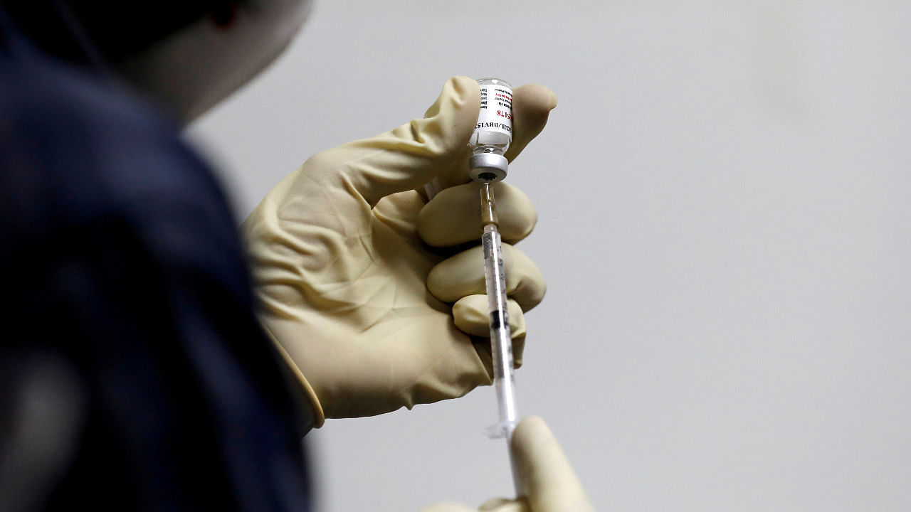 A medic fills a syringe with Covaxin. Credit: Reuters File Photo