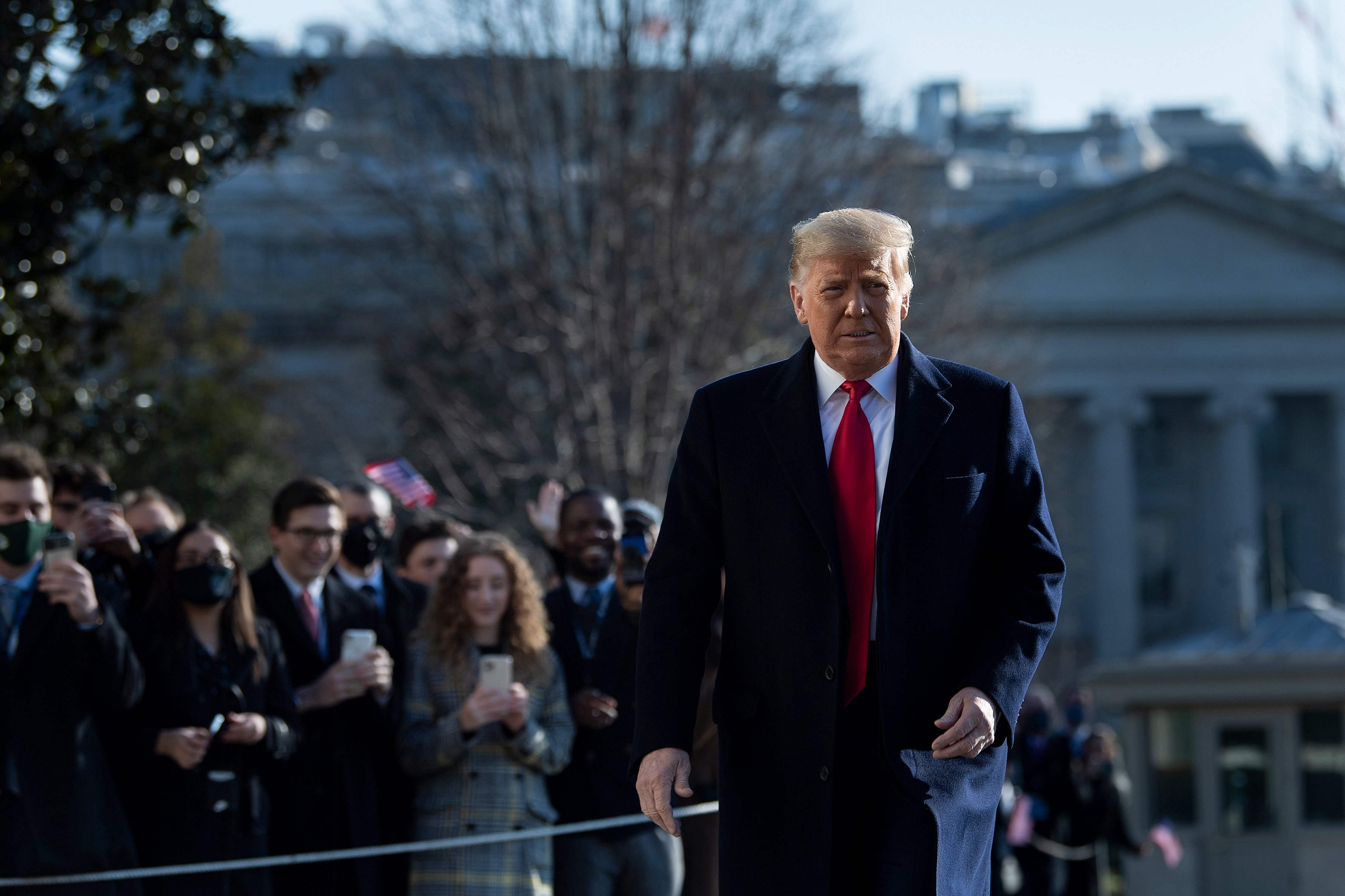 US President Donald Trump walks by supporters outside the White House on January 12, 2021 in Washington,DC before his departure to Alamo, Texas. Credit: AFP Photo