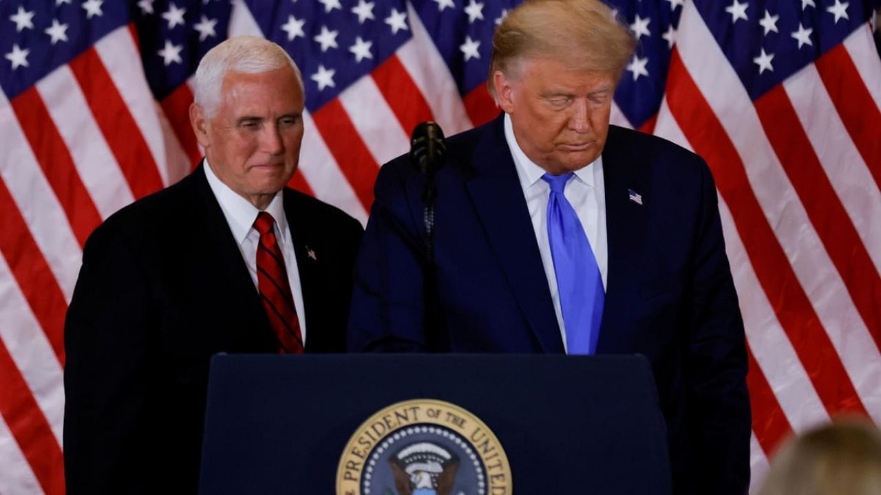 US President Donald Trump and Vice President Mike Pence stand while making remarks about early results from the 2020 US presidential election in the East Room of the White House in Washington. Credit: Reuters file photo.